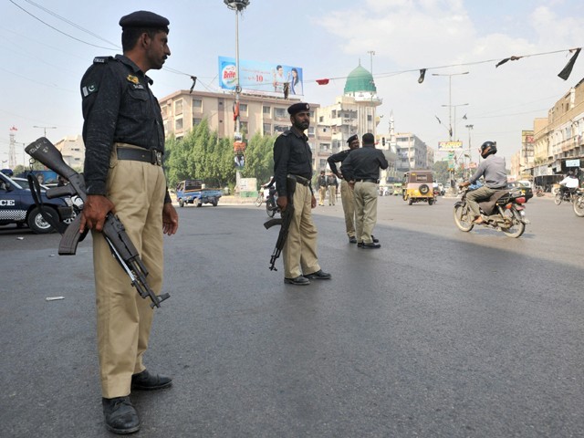 Two Karachi banks robbed and a guard killed in one hour